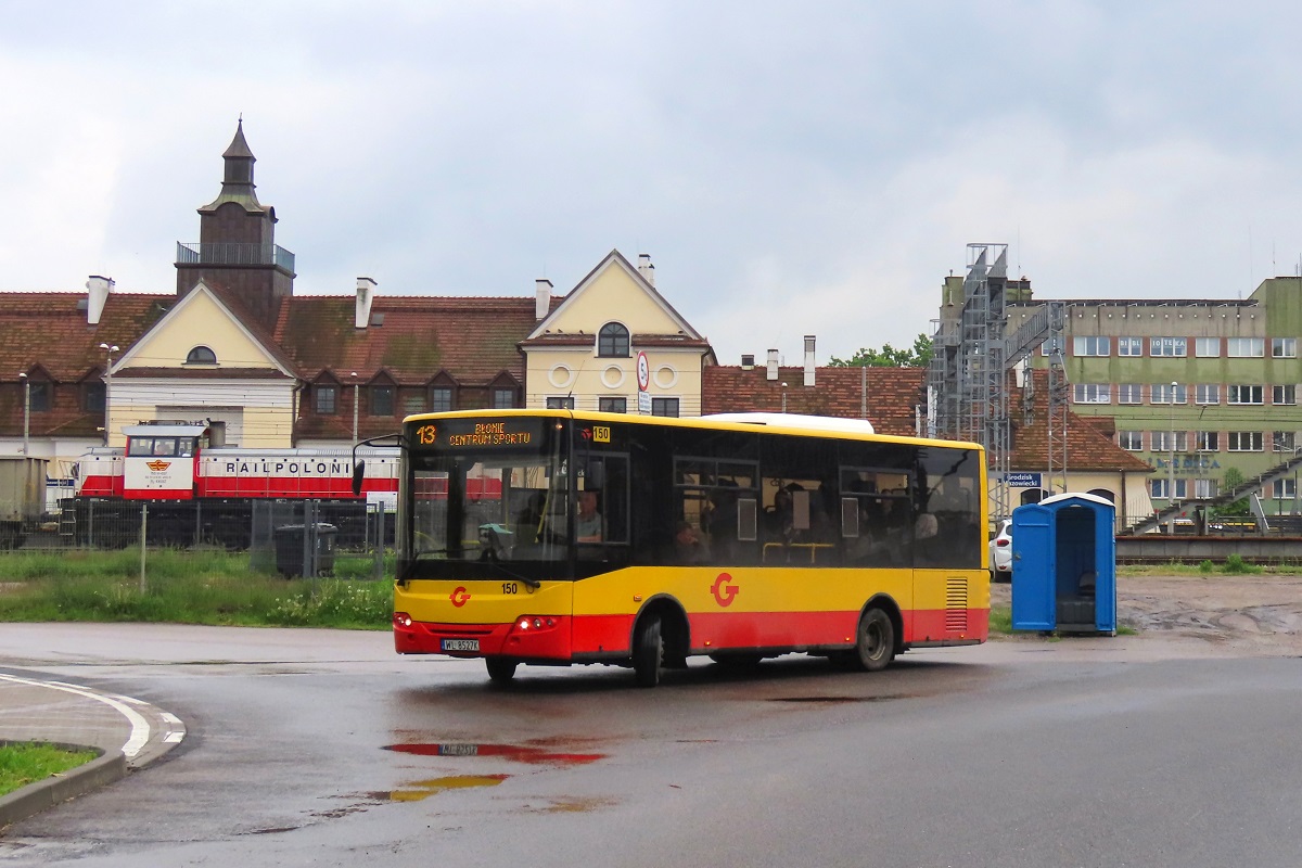 150 (22033)
ZAZ jedzie jako kurs 113 linii numer 13: Grodzisk Maz. Szpital (15:10)-BĹonie Centrum Sportu (16:07). 
W tle stoi 15D-037 na czele niewidocznych na zdjÄciu EamnosĂłw. 
